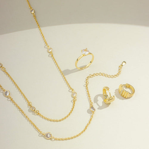 Brinco argola de click 6 listras lisas e zircônias no meio banhado a ouro 18k